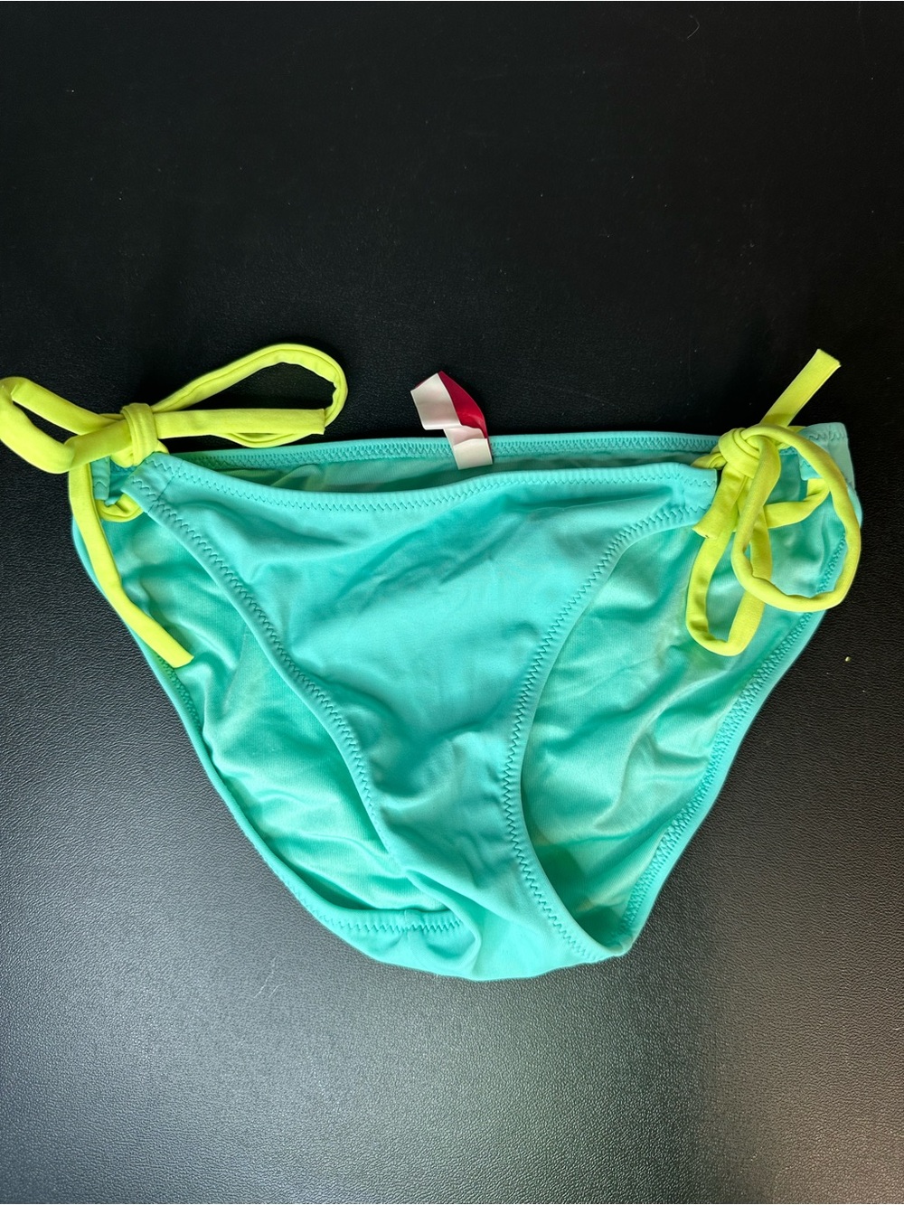 Victoria Secret mint bikini bottoms featuring bright yellow adjustable side ties